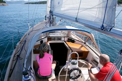 delivery skipper sailing with crew on a yacht delivery